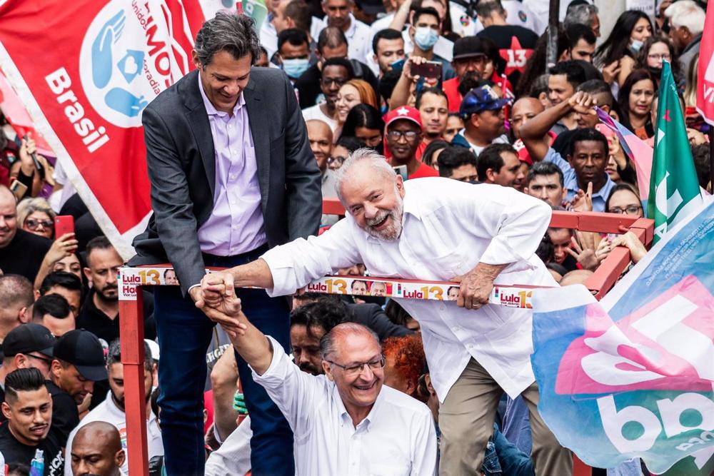 Brazilian president-elect Lula da Silva (right), former mayor of Sao Paulo Fernando Haddad (left) and Da Silva's running mate Geraldo Alckmin, vice-president elect Brazilian