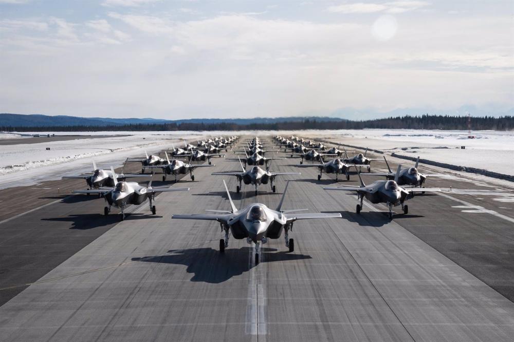 File - A formation of U.S. Air Force F-35 Lightning II aircraft assigned to the 354th Fighter Wing, perform a walk-around at the Air Force base. File. File