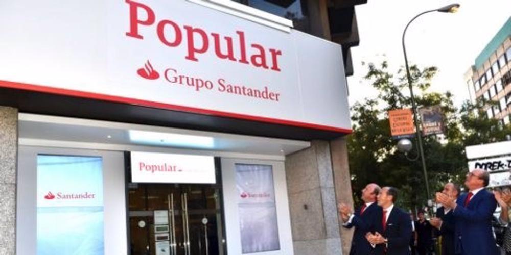 Archivo - Oficina de Banco Popular con el rótulo de Grupo Santander Archivo