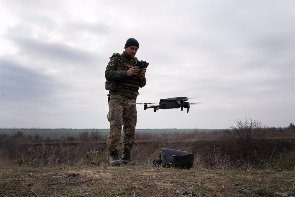 A Ukrainian soldier operating a reconnaissance drone. A