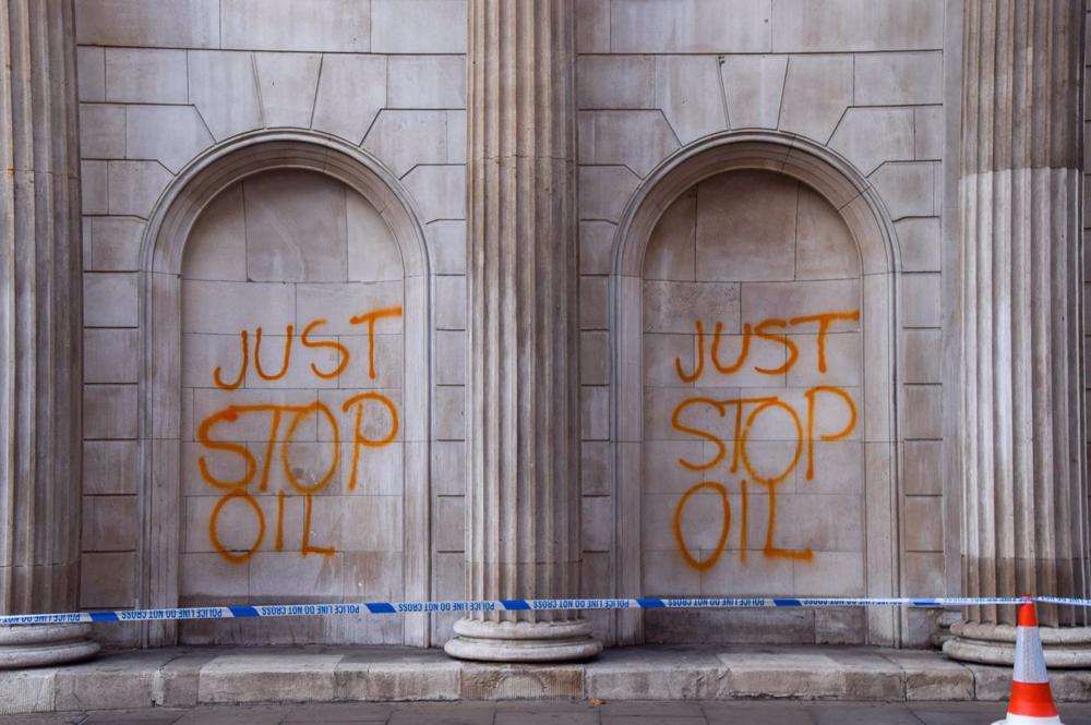 Just Stop Oil' graffiti on the facade of the Bank of England. Just
