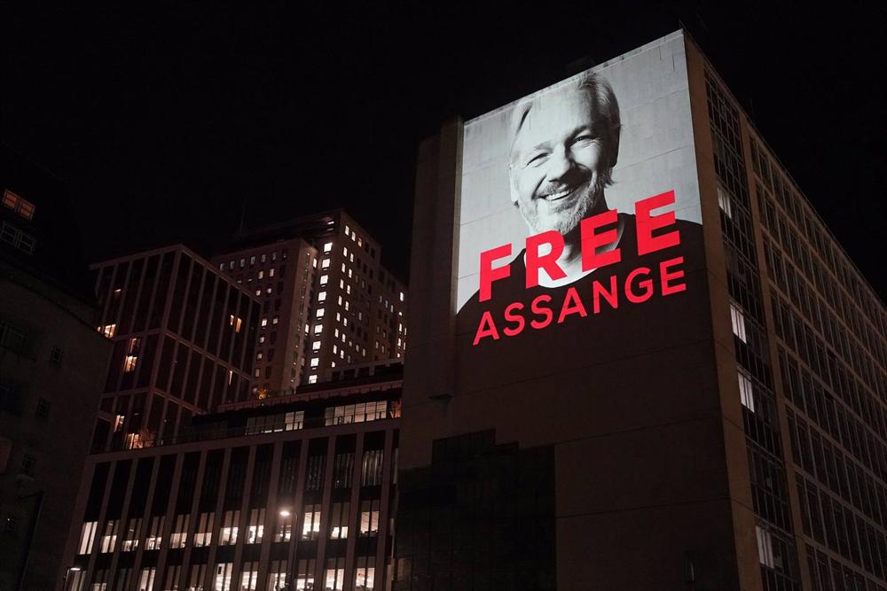 File - Image of Julian Assange projected onto a building in Leake Street, London, on the occasion of his arrest at Belmarsh Prison. File