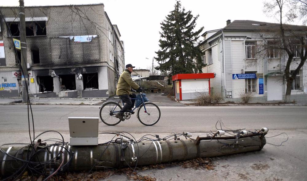 A man on a bicycle in Izium, near Kharkov, eastern Ukraine. A