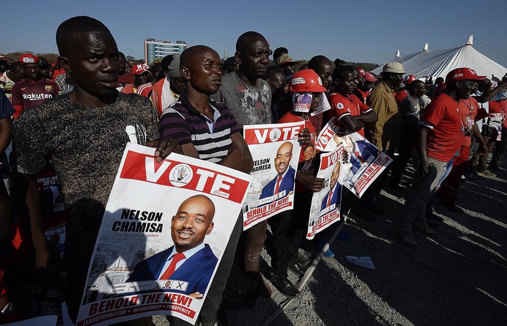 File - Supporters of Zimbabwean opposition leader Nelson Chamisa who heads the Citizen's Coalition for Change (CCC) File