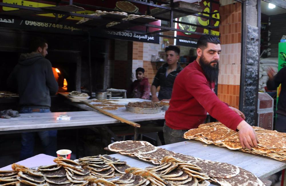 A baker in the city of Aleppo, Syria. A