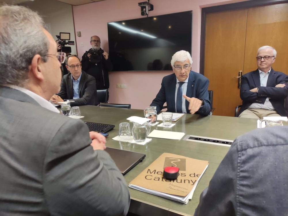 El secretario general de MC, Xavier Lleonart, y el conseller de Salud, Manel Balcells, en la sexta reunión de negociación El
