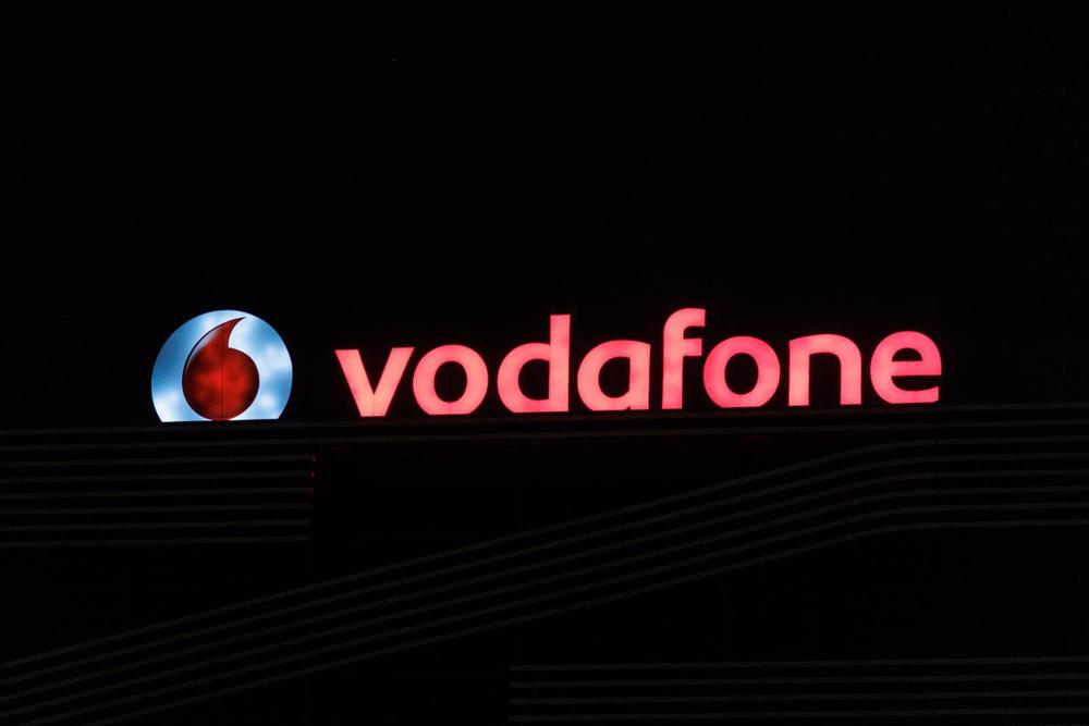 Archivo - Logo de la empresa de Vodafone encendido, a 10 de agosto de 2022, en Madrid (España). Archivo