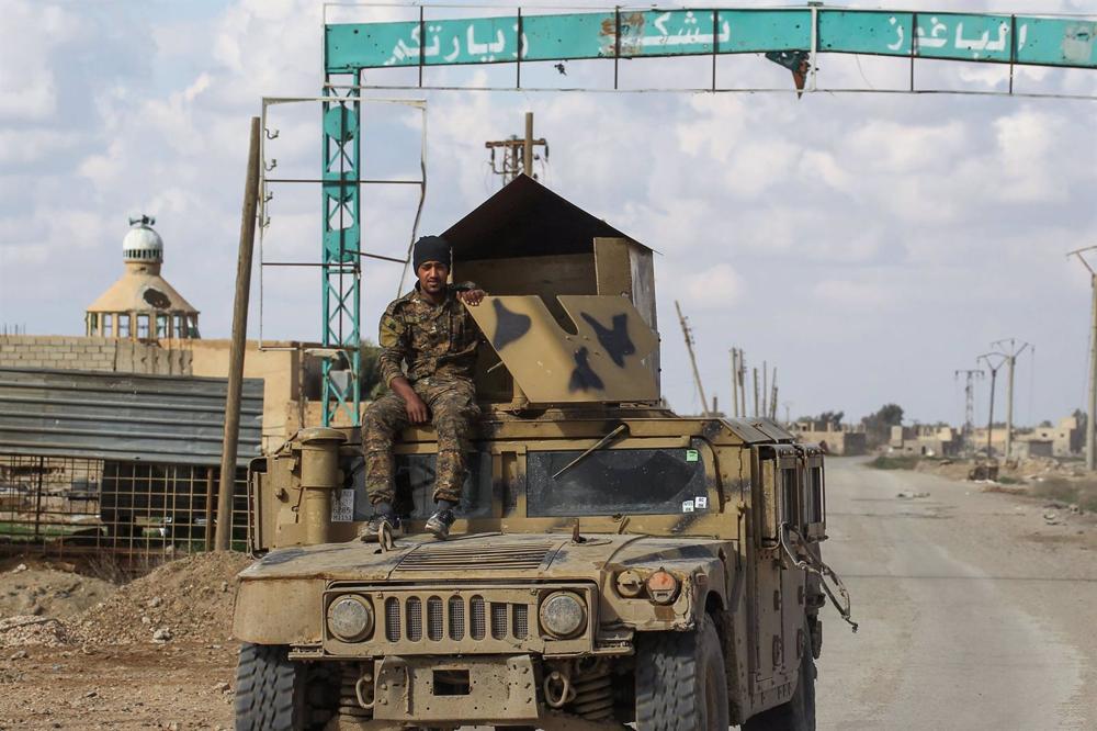 File - A Syrian Democratic Forces (SDF) militiaman in the Syrian town of Baghuz. File