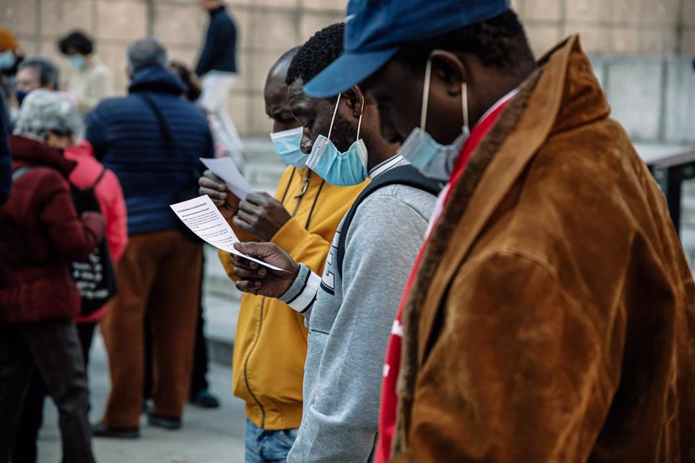File - Demonstrators take part in a rally on the occasion of Migrants' Day in Madrid. File