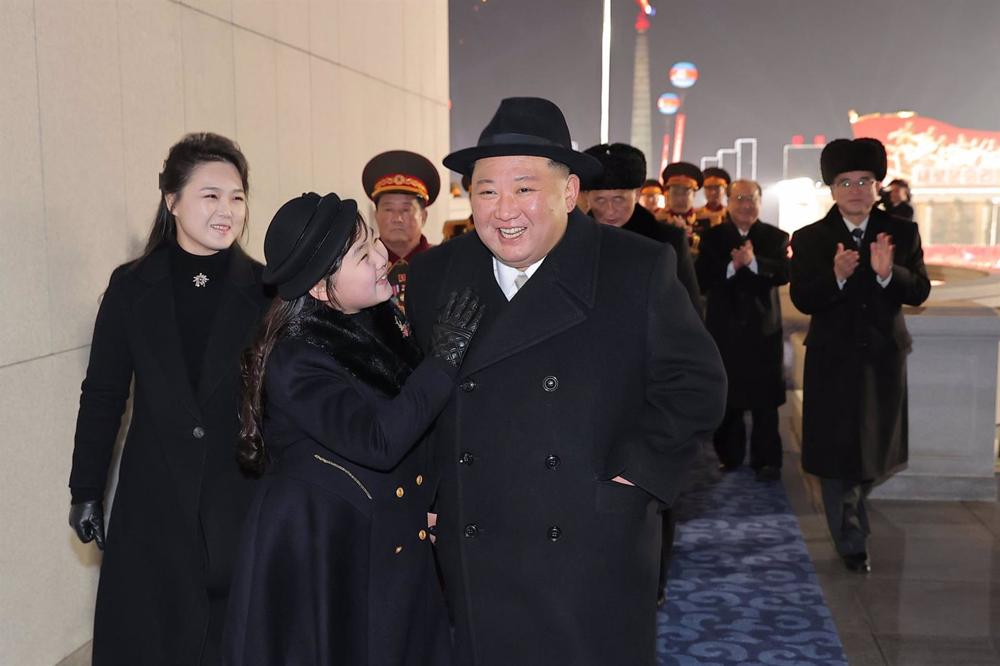 North Korean leader Kim Jong Un with his wife Ri Sol Ju (l) and daughter Ju Ae (c) during a military parade in Pyongyang to mark the 75th anniversary of the founding of the North Korean Army. North
