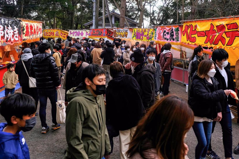 Archive - People wearing masks at Gokuraku Shrine in Tokyo, Japan. Archive
