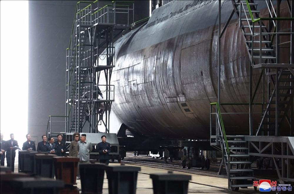 File - Kim Jong Un inspects the construction of a submarine in a file image. File