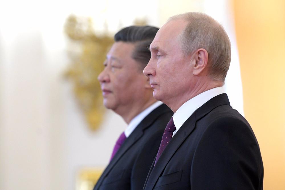 Archivo - Xi Jinping y Vladimir Putin durante una visita en 2019 Archivo