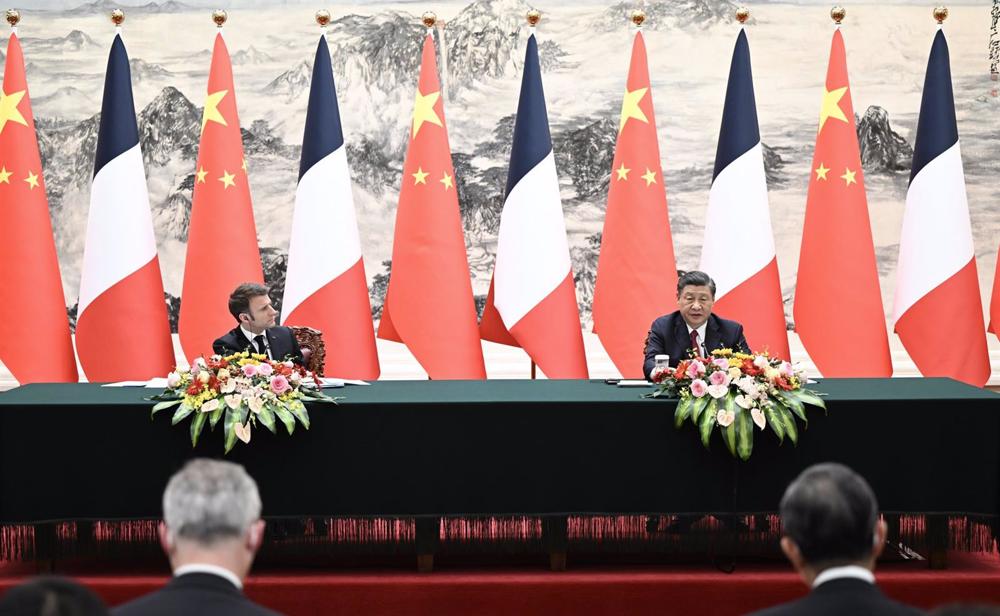 El presidente de Francia, Emmanuel Macron, junto a su homólogo chino, Xi Jinping El