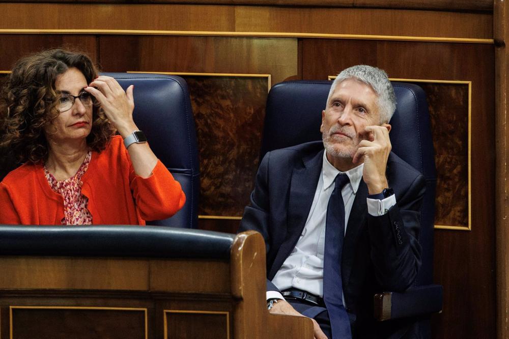 La ministra de Hacienda, María Jesús Montero, y el ministro de Interior, Fernando Grande-Marlaska, durante una sesión de control al Gobierno, en el Congreso de los Diputados La
